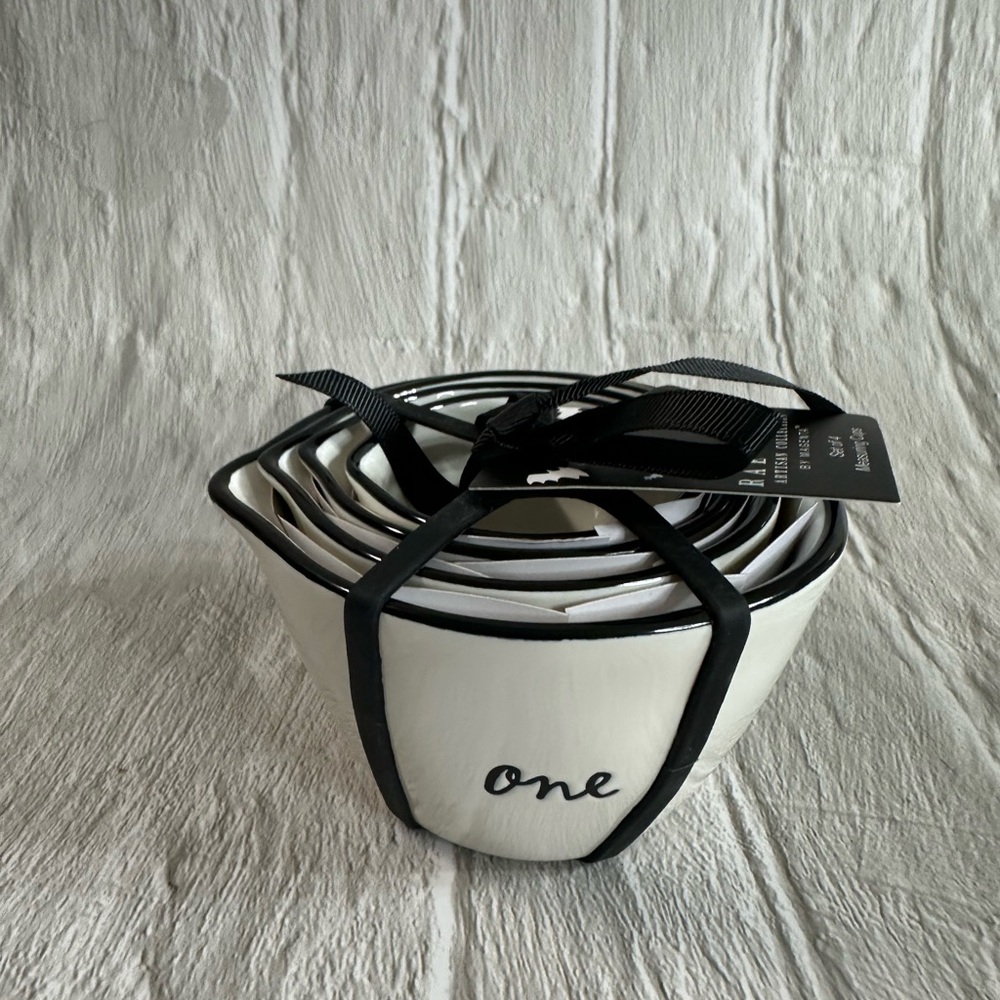 NWT Rae Dunn Set of Measuring cups numbered one-four and broom sticks